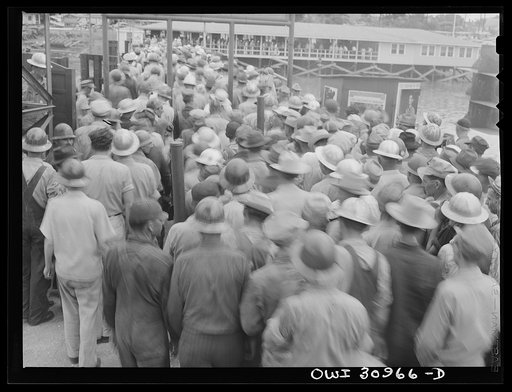 Untitled photo, possibly related to: Beaumont, Texas. Shipyard workers leaving the Pennsylvania shipyards at the change of shift