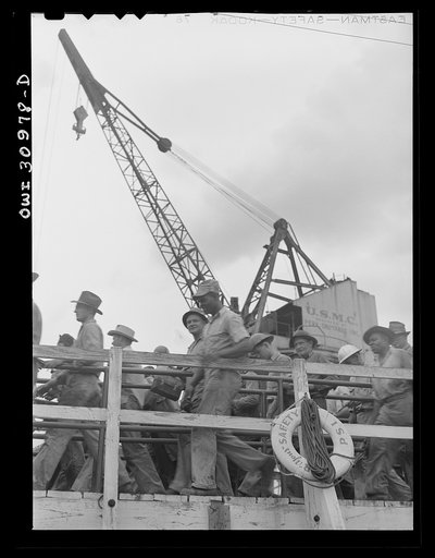 Untitled photo, possibly related to: Beaumont, Texas. Shipyard workers leaving the Pennsylvania shipyards at the change of shifts