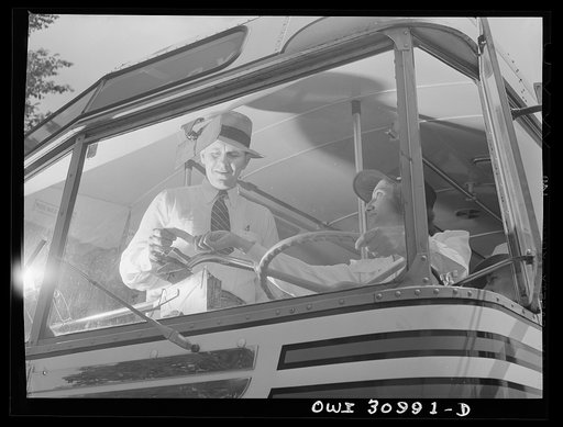 Beaumont, Texas. Passenger boarding a bus driven by Rush Gallagher