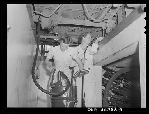 Beaumont, Texas. Mammie Fairchild and Dorothy Mason lubricating a bus at the city transit company