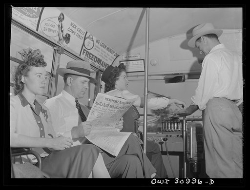 Beaumont, Texas. Passenger boarding a bus driven by Helen McCabe