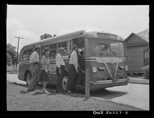 Beaumont, Texas. Passengers boarding a bus driven by Helen McCabe