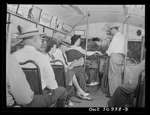 Beaumont, Texas. Passenger boarding a bus driven by Helen McCabe