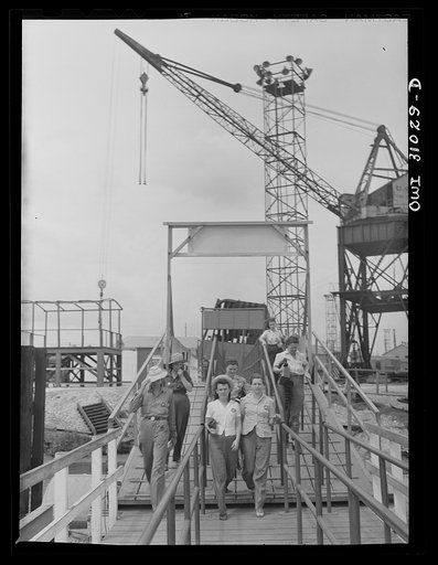 Untitled photo, possibly related to: Beaumont, Texas. Women workers leaving the Pennsylvania shipyards