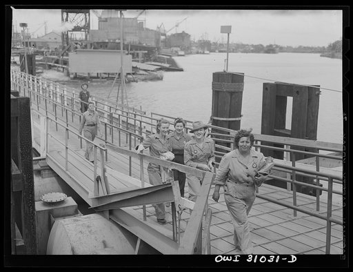 Untitled photo, possibly related to: Beaumont, Texas. Women workers leaving the Pennsylvania shipyards