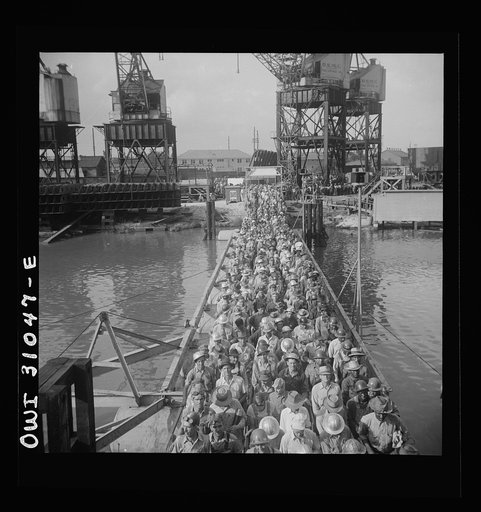 Untitled photo, possibly related to: Beaumont, Texas. Shipyard workers leaving the Pennsylvania shipyards at the change of shift