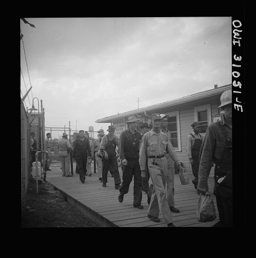 Untitled photo, possibly related to: Beaumont, Texas. Workers leaving the Pennsylvania shipyards at the change of shift