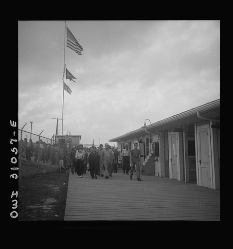 Untitled photo, possibly related to: Beaumont, Texas. Workers leaving the Pennsylvania shipyards at the change of shift