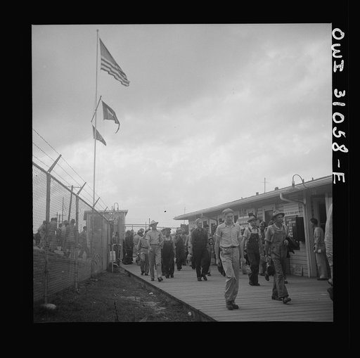 Untitled photo, possibly related to: Beaumont, Texas. Workers leaving the Pennsylvania shipyards at the change of shift