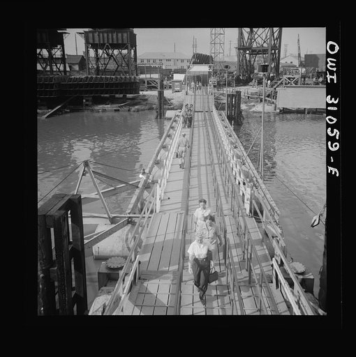 Untitled photo, possibly related to: Beaumont, Texas. Women workers leaving the Pennsylvania shipyards