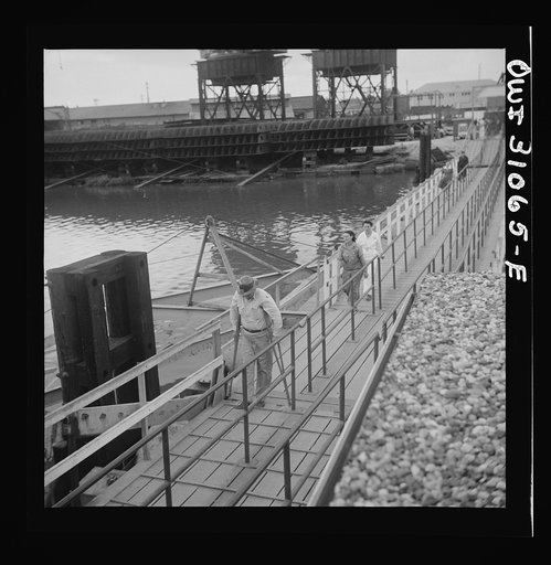 Beaumont, Texas. Workers leaving the Pennsylvania shipyards