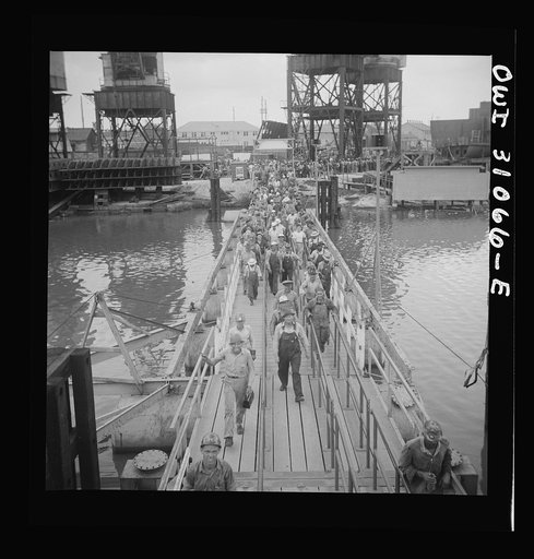 Untitled photo, possibly related to: Beaumont, Texas. Shipyard workers leaving the Pennsylvania shipyards at the change of shift