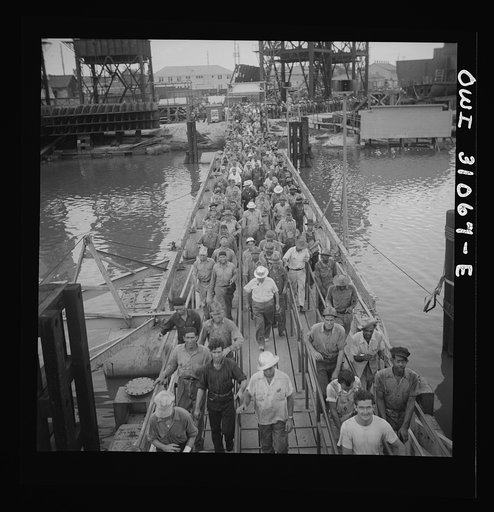 Untitled photo, possibly related to: Beaumont, Texas. Workers leaving the Pennsylvania shipyards
