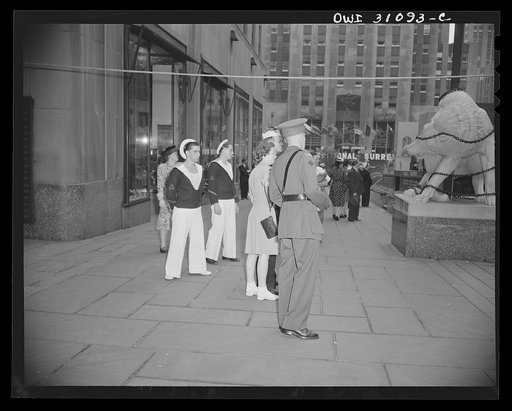 New York, New York. British officer and French sailors view display at the Nature of the Enemy exhibition, designed by OWI (Office of War Information) and installed on the plaza of Rockefeller center