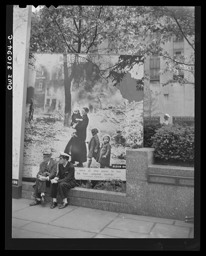 Untitled photo, possibly related to: New York, New York. Spectators attracted by the exhibits at the Nature of the Enemy show, put up by the United States OWI (Office of War Information) at Rockefeller Plaza