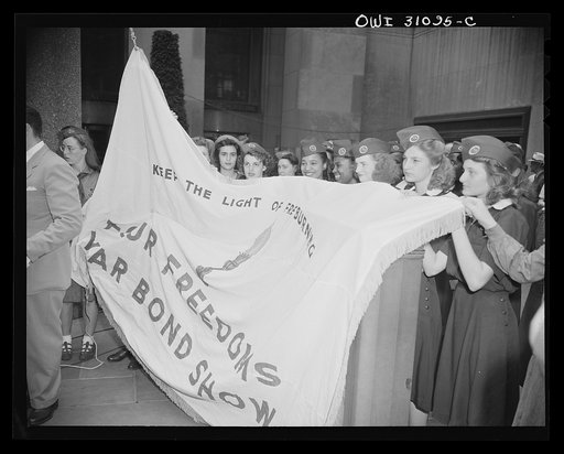 New York, New York. Members of the Great New York Council of Girl Scouts participating in the opening of the Four Freedoms war bond show in the plaza of the International building at Rockefeller Center