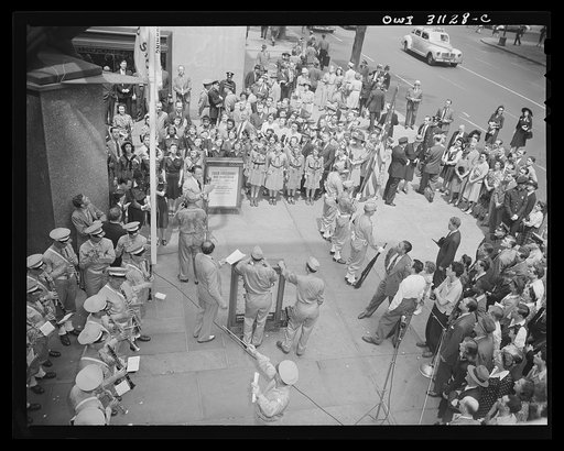 New York, New York. Flag-raising ceremony at the Four Freedoms war bond show in the plaza of the International Building in Rockefeller Center