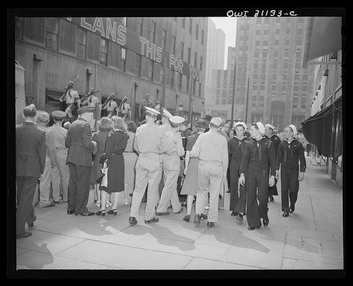 New York, New York. Crowd of servicemen and women of many nations at the Nature of the Enemy exhibition, designed by the OWI (Office of War Information) and installed on the plaza of Rockefeller Center