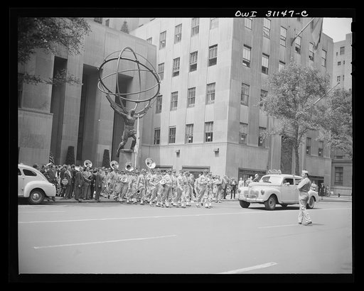 New York, New York. Army band leaving the plaza of the International Building at Rockefeller Center after the opening ceremony of the Four Freedoms war bond show