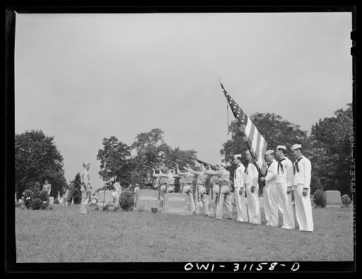 Untitled photo, possibly related to: Merchant marine seaman given military funeral. Members of the Army and Coast Guard honor guards stand in silence as Herman Sweitzer, merchant marinehere, is buried at Mount Olivet Cemetery at Baltimore. This was the first time any but an Army or Navy man has been