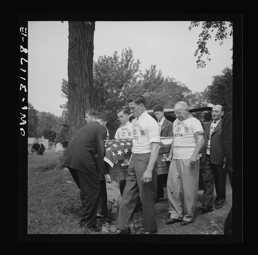 Baltimore, Maryland. Funeral of a merchant seaman. Pallbearers with flag-covered casket