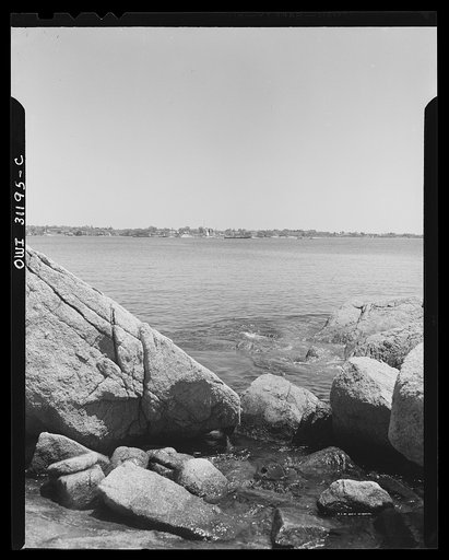 Gloucester, Massachusetts. New England coast, lined with great masses of rocks