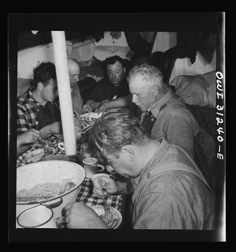 On board the fishing boat Alden, out of Gloucester, Massachusetts. Italian spaghetti is served after a hard day's work. The men eat large portions, for it may be another twelve hours before they sit down to another meal