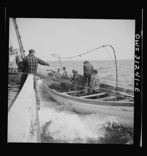 Untitled photo, possibly related to: On board the fishing boat Alden, out of Gloucester, Massachusetts. Fishermen resting after a twenty-four hour workout. Catholic images are above their bunks