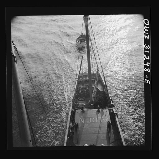 Untitled photo, possibly related to: On board the fishing boat Alden out of Gloucester, Massachusetts. A scene at sea showing the mother ship towing a small dory