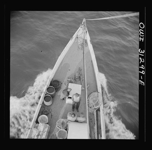 On board the fishin boat Alden out of Gloucester, Massachusetts. The bow of the Alden nosing out to the sea early in the morning