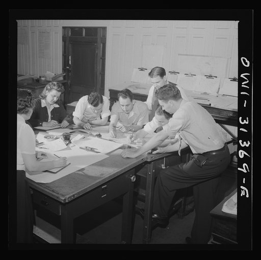 Washington, D.C. Preparing an advisory forecast at the U.S. Weather Bureau.  Joe F. Fulks supervising the preparation of weather analyses