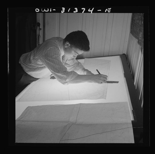 Washington, D.C. Preparing an advisory forecast at the U.S. Weather Bureau. Cutting a manuscript weather map into sections for speedy plotting