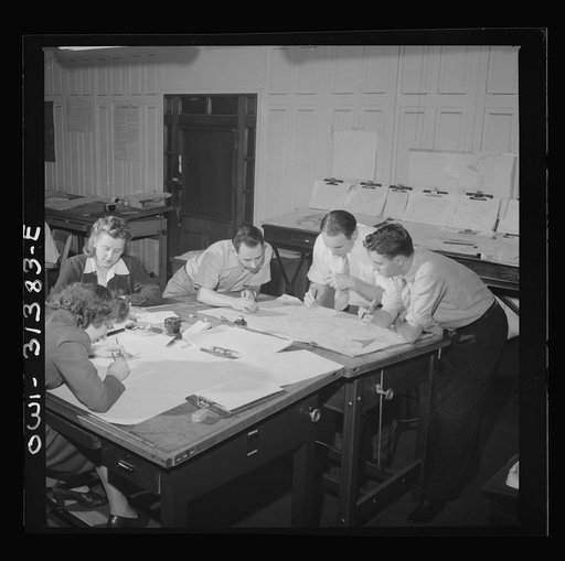 Untitled photo, possibly related to: Washington, D.C. Preparing an advisory forecast at the U.S. Weather Bureau. Joe F. Fulks supervising the preparation of weather analyses