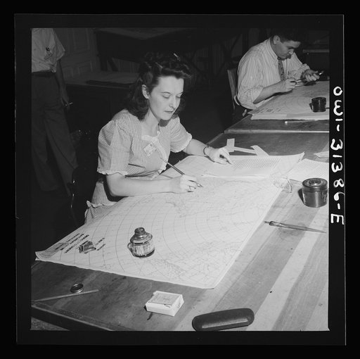 Untitled photo, possibly related to: Washington, D.C. Preparing an advisory forecast at the U.S. Weather Bureau. Preparing an auxiliary weather map which reveals upper atmospheric conditions