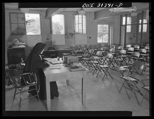 Washington, D.C. Sister Aquinas, "flying nun," in her classroom at Catholic University, where she conducts a civil aeronautics authority for instructors