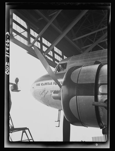 Untitled photo, possibly related to: Washington, D.C. The "flying nun" from Ironwood, Michigan, walking down the field at the Washington National Airport after taking her class through the hangars. Sister Aquinas holds a student pilot's license and has many flying hours to her credit