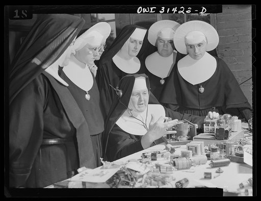 Washington, D.C. Sister Aquinas teaching a lesson in practical radio operations to the Sisters attending her Civil Aeronautics Authority course for instructors at Catholic University