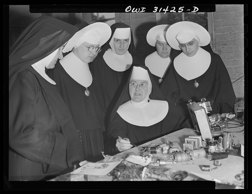 Untitled photo, possibly related to: Washington, D.C. Sister Aquinas teaching a lesson in practical radio operations to the Sisters attending her Civil Aeronautics Authority course for instructors at Catholic University