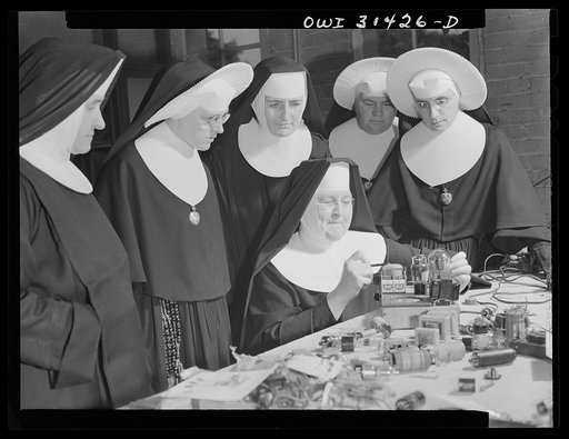 Untitled photo, possibly related to: Washington, D.C. Sister Aquinas teaching a lesson in practical radio operations to the Sisters attending her Civil Aeronautics Authority course for instructors at Catholic University