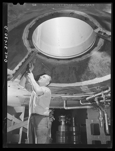 Pittsburgh, Pennsylvania. Lower bracket of the 30,000 kilowatt waterwheel generator which Westinghouse Electric Company is manufacturing for the Watts Bar Dam of the Tennessee Valley Authority (TVA), from underneath, showing hole through which the shaft is passed. The bracket supports the thrust bea