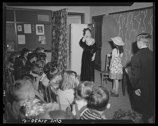 Schenectady, New York. Fourth grade students at the Oneida School presenting a play they have written from the book Heidi. The audience is composed of neighbor children and their parents; admission is five cents. The proceeds go to the American Red Cross