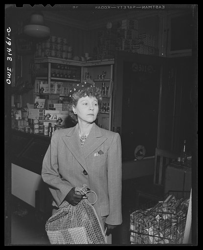 A woman customer in a store, in a scene in "Black Marketing," a motion picture produced by the U.S. Office of War Information (OWI) and released on August 19, 1943