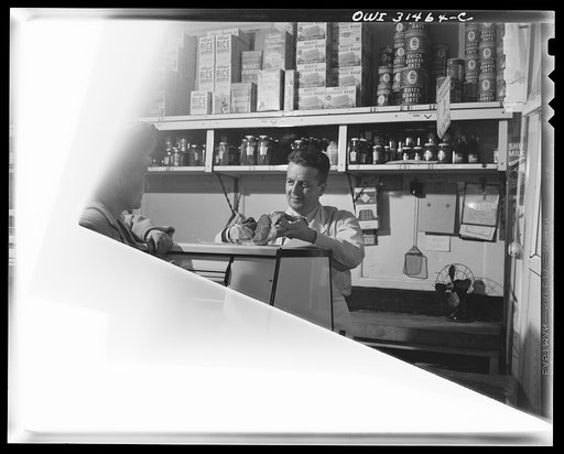 Butcher in a grocery store, in a scene during the filming of "Black Marketing,"a motion picture produced by the United States Office of War Information (OWI)