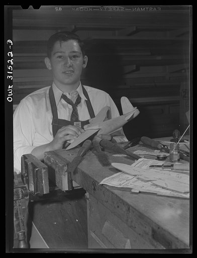 Untitled photo, possibly related to: Oswego, New York. Oswego high school boy who made seventy model planes for the Navy, and was awarded honorary rank of Admiral