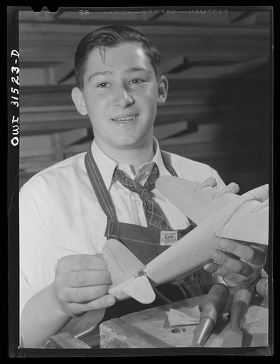 Oswego, New York. Oswego high school boy who made seventy model planes for the Navy, and was awarded honorary rank of Admiral