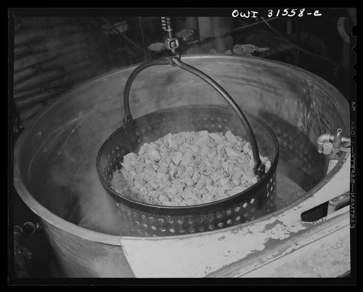 Cincinnati, Ohio. Preparing canned pork (Russian: "svinaia tushonka") for lend-lease shipment to the USSR at the Kroger grocery and baking company. Pork being removed from pot boilers, where it is cooked eight minutes at 180 degrees and treated for twenty percent pre-shrinkage