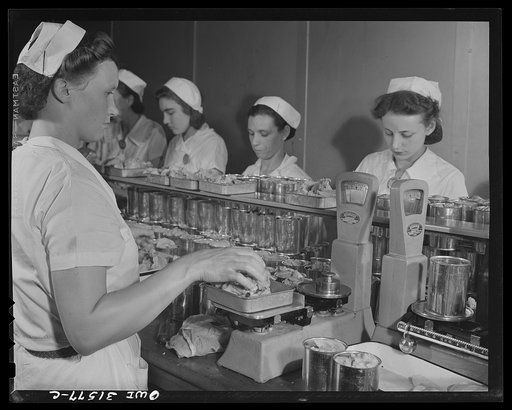 Cincinnati, Ohio. Preparing canned pork for lend-lease shipment to USSR. Kroger Company. Tins of pork on packing line