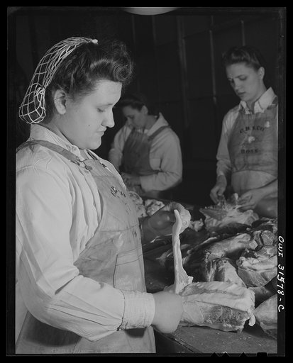 Cincinnati, Ohio. Preparing canned pork (Russian: "svinaia tushonka") for lend-lease shipment to the USSR at the Kroger grocery and baking company. Maudeen Hood, age nineteen, removing fat from pork. She formerly did housework. Her husband is in the U.S. Army
