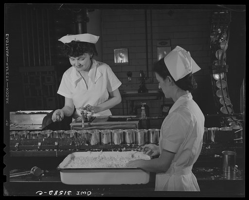 Cincinnati, Ohio. Preparing canned pork (Russian: "svinaia tushonka") for lend-lease shipment to the USSR at the Kroger grocery and baking company. Girls placing lard, spice and onions in cans before the pork is added. Left to right: Bonnie Williams, age twenty-one, used to work in shirt factory, ha