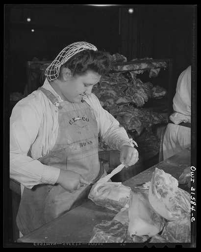 Cincinnati, Ohio. Preparing canned pork (Russian: "svinaia tushonka") for lend-lease shipment to the USSR at the Kroger grocery and baking company. Maudeen Hood, age nineteen, removing fat from pork. She used to do housework, and her husband is in the United States Army